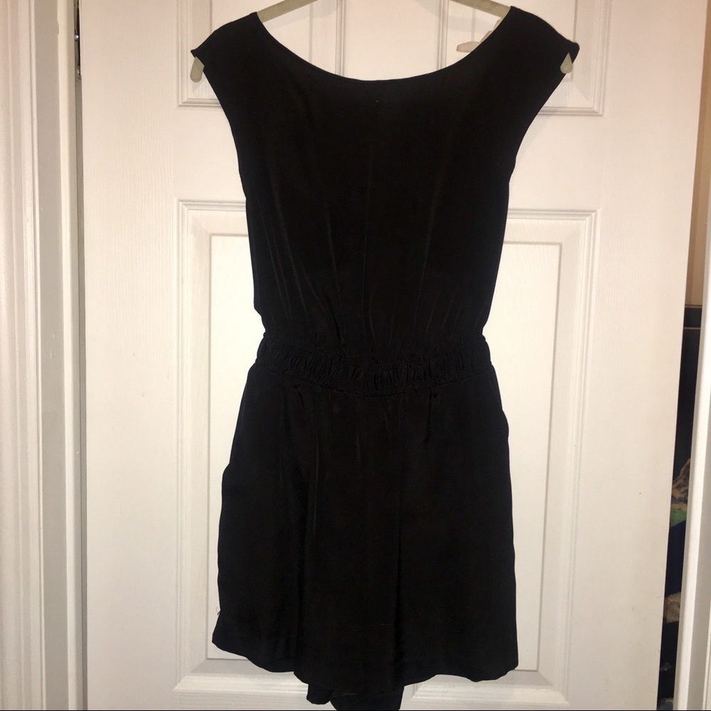 Black romper with flowy open back